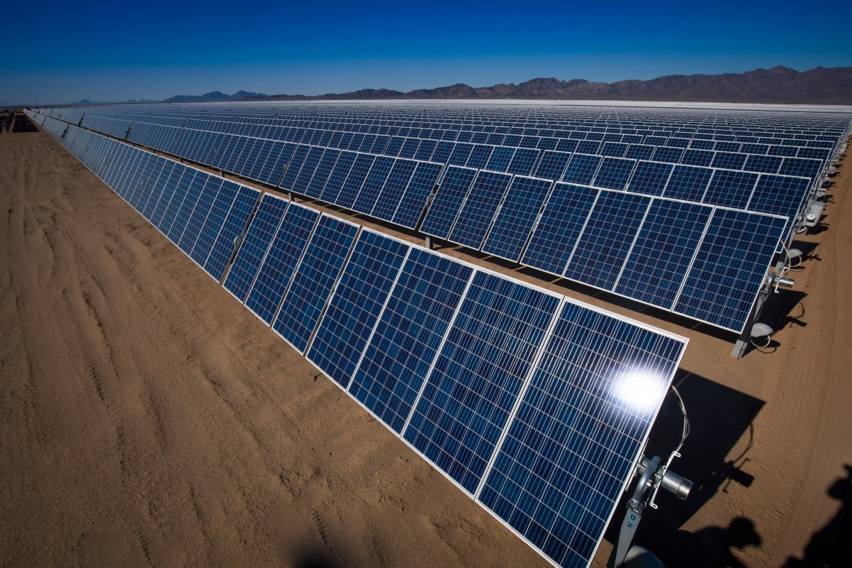 A row of solar panels in the California desert