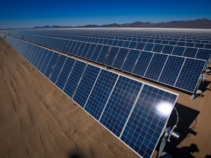 A row of solar panels in the California desert