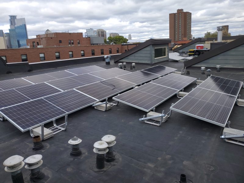 Solar panels atop one of Beacon Interfaith Housing Collaborative's Minneapolis apartment buildings.