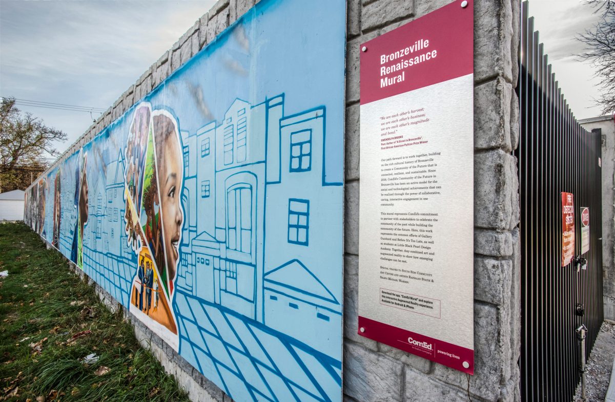 The right half of a mural features STEM-related themes, with a sign that identifies the artwork as the "Bronzeville Renaissance Mural"