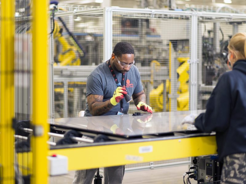 Crew members perform an inspection at one of First Solar’s Ohio manufacturing plants.