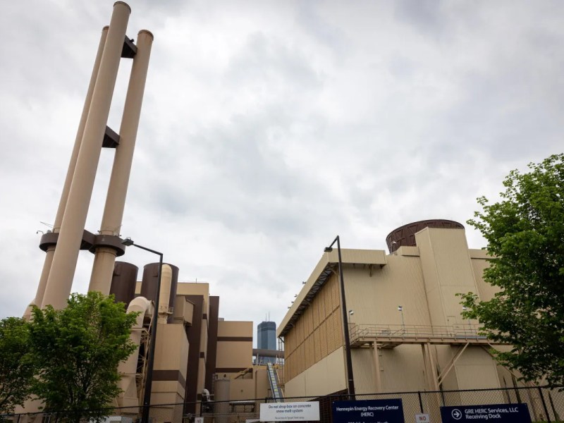 A photo of a waste-to-energy plant in Minneapolis with a cloudy sky in the background