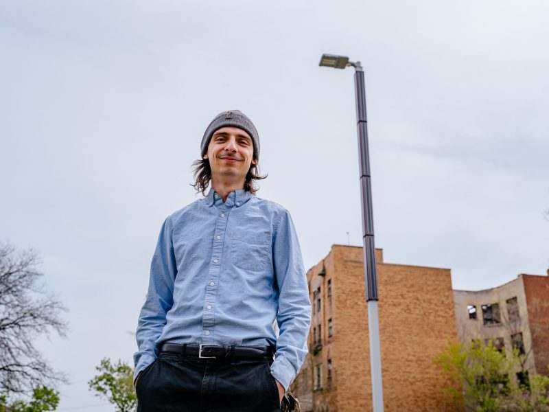 Jackson Koeppel, outgoing executive director and co-founder of Soulardarity, near a solar-powered streetlight near the Soulardarity office.