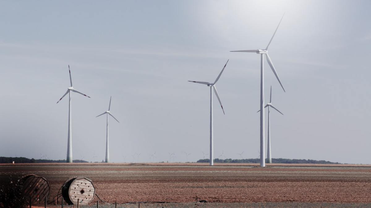 A wind farm in a nondescript rural area.