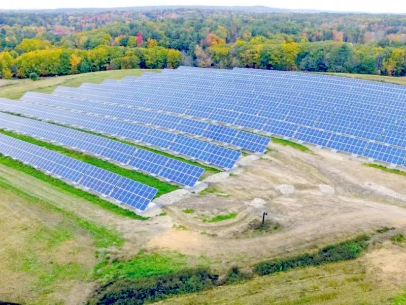 Aerial photo of solar panels atop a former landfill near Portland, Maine.