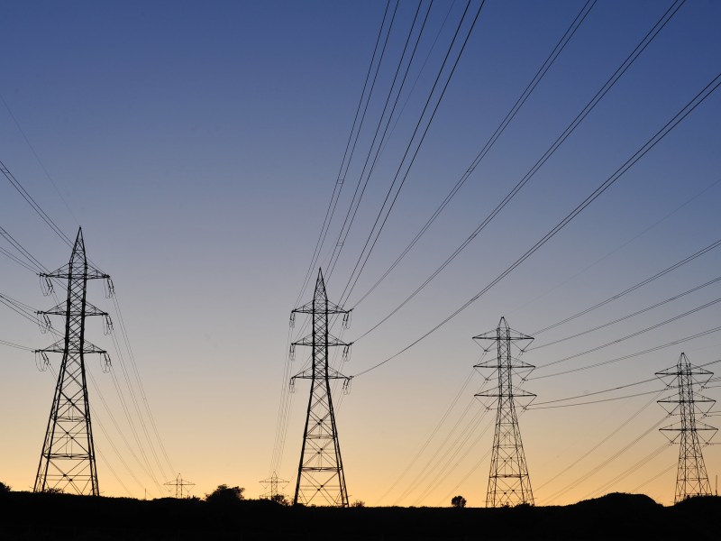 Transmission towers at sunset