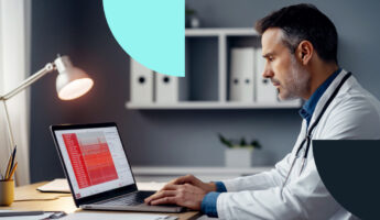 Doctor analyzing data on a laptop in a office